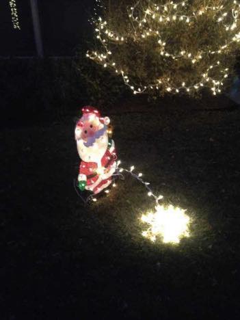 Santa peeing in lights.jpg