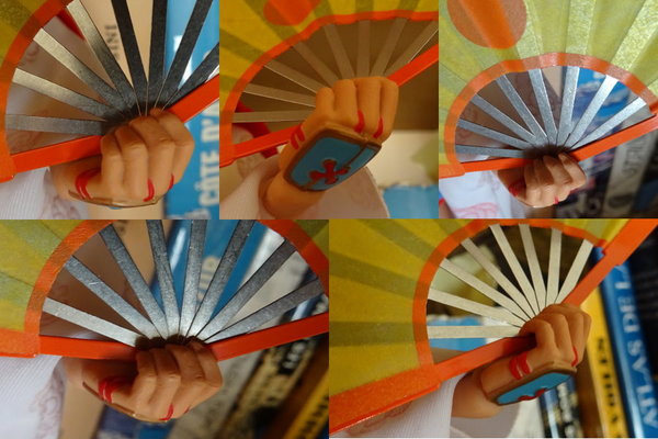 Tomoe holding fan