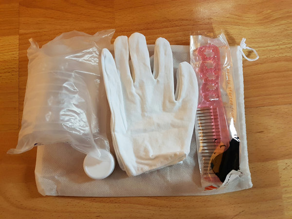 Bag of Goodies: Gloves, cleaner, tub of stain remover, comb and baby doll dress (not pictured)