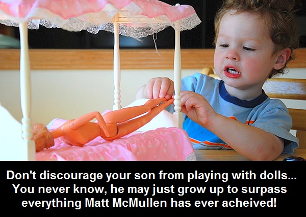 Boy-Playing-With-Barbie-Holder.jpg