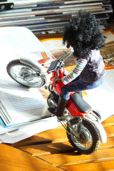 Tessa on her Montessa on the kitchen table