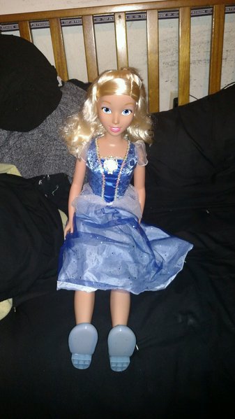 This is Cinderella out of the box and sitting on the bed. I was so happy to see that she didn't have the wide legged splayed feet seated pose that some of the My Size Dolls have. It's my preference that the legs are together when seated.