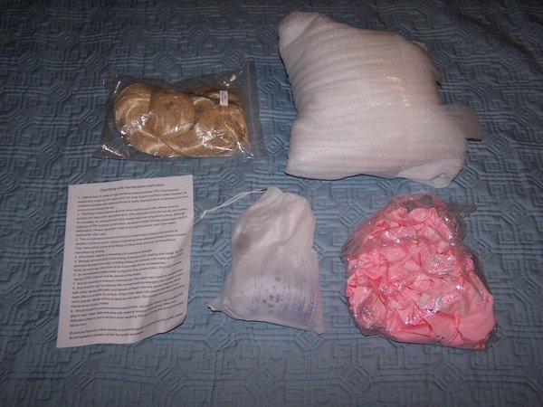 Unpacking items.<br />We got here the factory wig, the head, care instructions, the goodie bag, and the mysterious &quot;random outfit&quot;