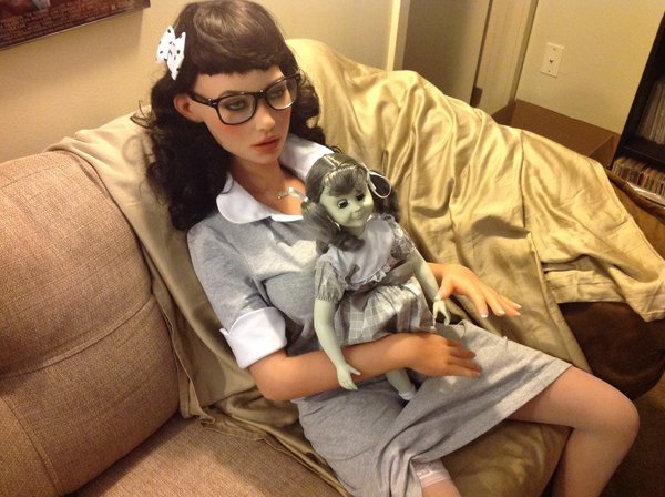 While I was gone, Alison hung out with my collectible Twilight Zone Talky Tina doll. Creepy!