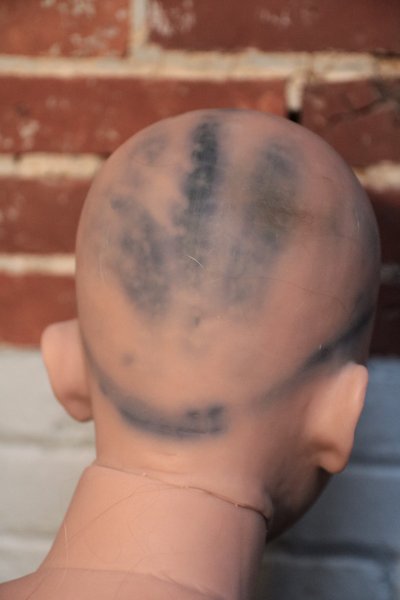 Damage 1: wig marks on back of head