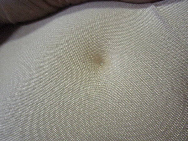 Belly Button stitch on outer skin.<br />Goes through a few times to ensure hold.