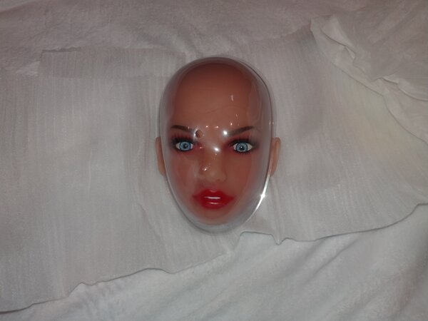 Unwrapped head and plastic molded face shield.